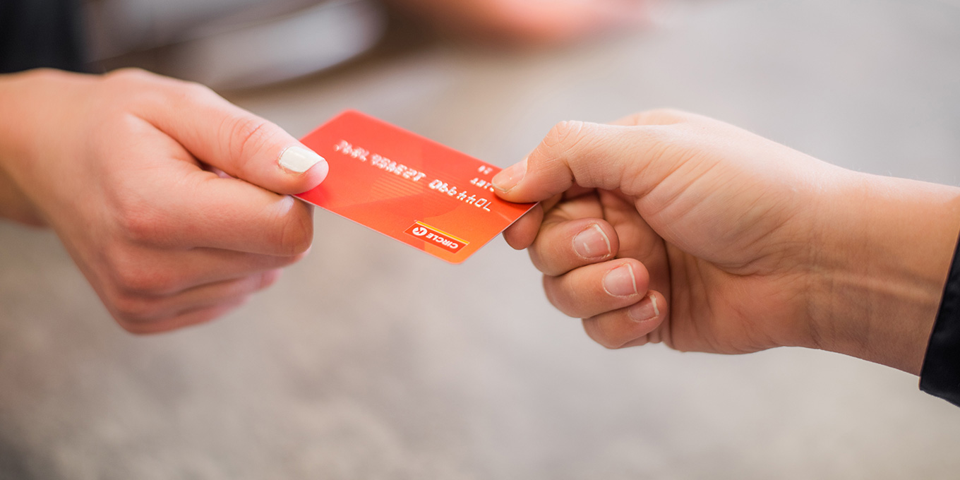 Customer handing over a fuel card