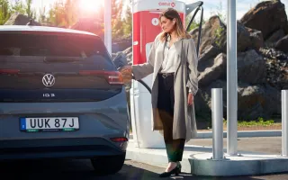 Woman fueling her car