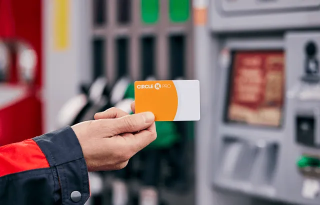 Person holding Circle K Pro card at a Circle K station