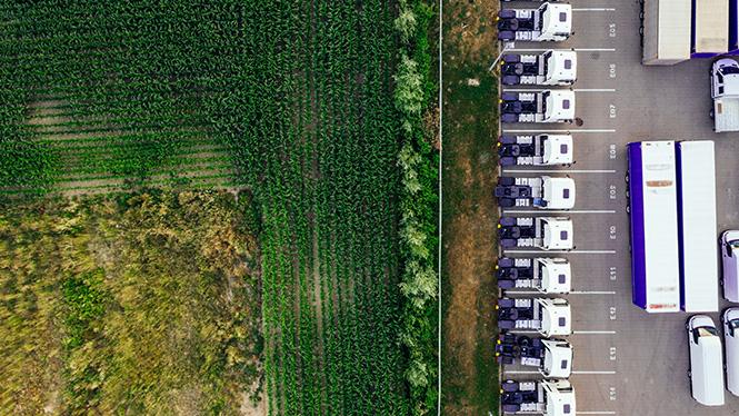 Overhead view of a field next to a lorry park