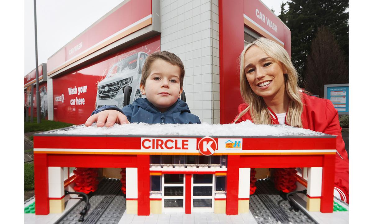 Stephania and a child behing a miniature of a CK station