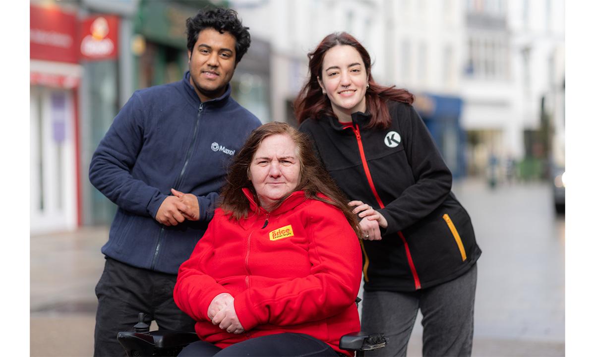 Three people posing to the photo, wearing Circle K, Maxol and MrPRICE uniforms
